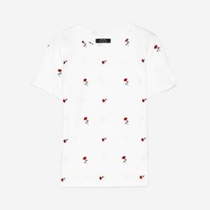 Rose covered white tee.